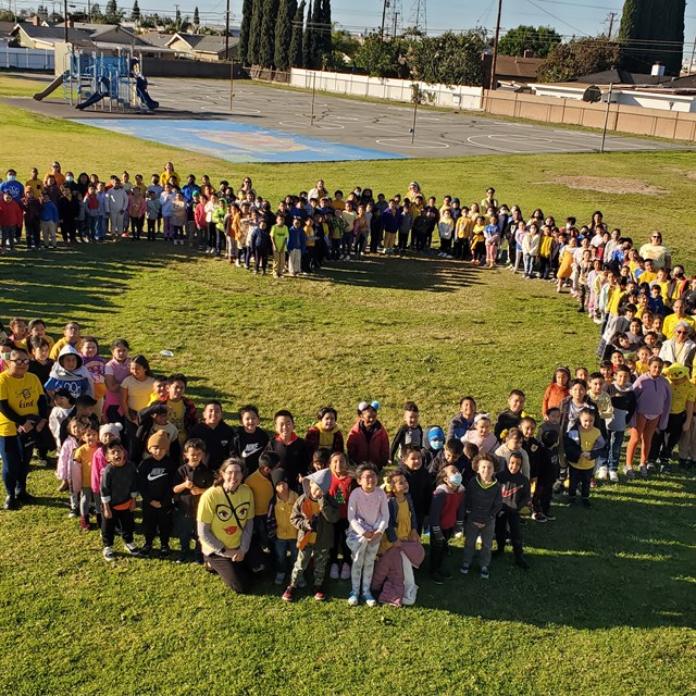 Students standing in a heart shape for Kindness Week